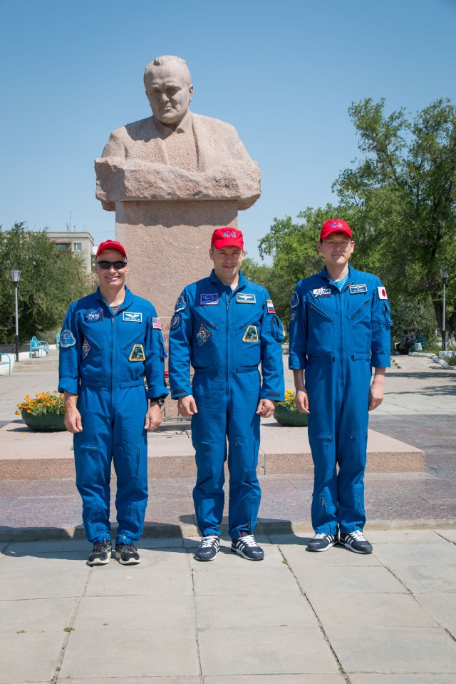 Expedition 52-53 backup crewmembers Mark Vande Hei of NASA (left), Alexander Misurkin of the Russian Federal Space Agency (Roscosmos, center) and Norishige Kanai of the Japan Aerospace Exploration Agency (JAXA, right) pose for pictures in front of the statue of Sergey Korolev, the iconic Russian space designer, during traditional ceremonies July 18 in Baikonur, Kazakhstan. The three are serving as backups to Sergey Ryazanskiy of Roscosmos, Randy Bresnik of NASA and Paolo Nespoli of the European Space Agency, who will launch July 28 on the Soyuz MS-05 spacecraft from the Baikonur Cosmodrome for a five-month mission on the International Space Station.