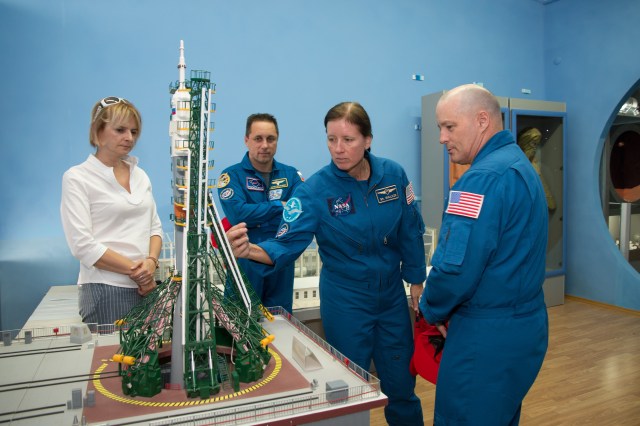 At the Space Museum in the town of Baikonur, Kazakhstan, Expedition 53-54 backup crewmembers Anton Shkaplerov of Roscosmos (second from left), Shannon Walker of NASA (second from right) and Scott Tingle of NASA (right) receive a briefing on a mockup of a Soyuz rocket on its launch pad from a museum guide in a traditional pre-launch activity Sept. 8. They are serving as backups to the prime crewmembers, Joe Acaba of NASA, Alexander Misurkin of Roscosmos and Mark Vande Hei of NASA, who will launch on Sept. 13 from the Baikonur Cosmodrome in Kazakhstan on the Soyuz MS-06 spacecraft for a five and a half month mission on the International Space Station.