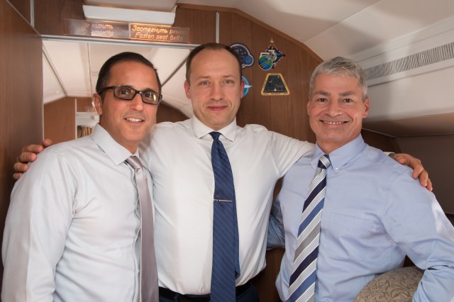 Aboard the Gagarin Cosmonaut Training Center Aircraft en route from their training base to their launch site at the Baikonur Cosmodrome in Kazakhstan for final pre-launch training, Expedition 53-54 crewmembers Joe Acaba of NASA (left), Alexander Misurkin of Roscosmos (center) and Mark Vande Hei of NASA (right) pose for pictures Sept. 6. They will launch Sept. 13 on the Soyuz MS-06 spacecraft from the Baikonur Cosmodrome for a five and a half month mission on the International Space Station.
