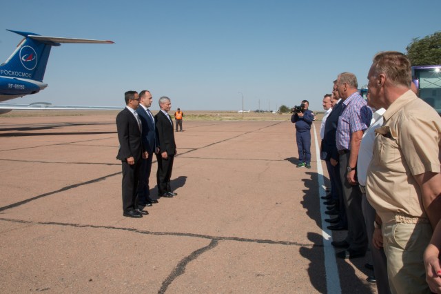 Expedition 53-54 crewmembers Joe Acaba of NASA (left), Alexander Misurkin of Roscosmos (center) and Mark Vande Hei of NASA (right) report to Russian space officials after arriving at their launch site at the Baikonur Cosmodrome in Kazakhstan Sept. 6 following a flight from their training base in Star City, Russia for final pre-launch training. They will launch Sept. 13 on the Soyuz MS-06 spacecraft from the Baikonur Cosmodrome for a five and a half month mission on the International Space Station.