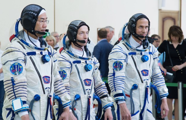 jsc2019e035253 (June 26, 2019) --- At the Gagarin Cosmonaut Training Center in Star City, Russia, Expedition 60 backup crewmembers Soichi Noguchi of the Japan Aerospace Exploration Agency (left), Sergey Ryzhikov of Roscosmos (center) and Tom Marshburn of NASA (right) report for their final qualification exams June 26. They are the backups to the prime crew, Alexander Skvortsov of Roscosmos, Drew Morgan of NASA and Luca Parmitano of the European Space Agency, who will launch July 20 on the Soyuz MS-13 spacecraft from the Baikonur Cosmodrome in Kazakhstan for a mission on the International Space Station. Credit: NASA/Beth Weissinger