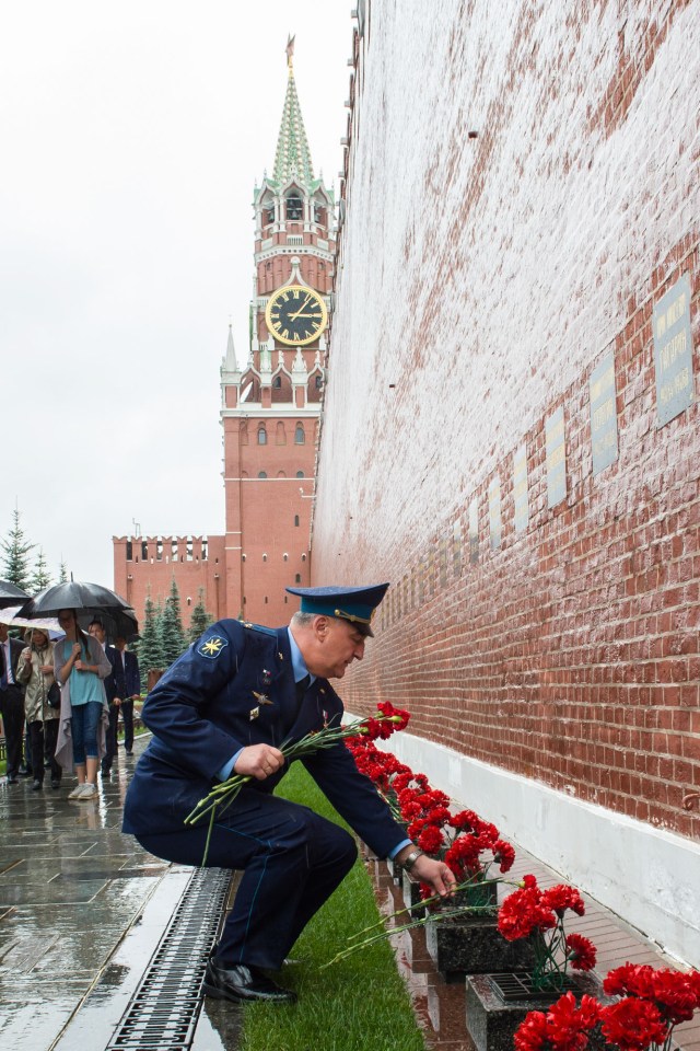 jsc2019e036802 (June 28, 2019) --- At Red Square in Moscow, Expedition 60 crewmember Alexander Skvortsov of Roscosmos lays flowers at the Kremlin Wall June 28 where Russian space icons are interred in traditional pre-launch activities. Skvortsov, Drew Morgan of NASA and Luca Parmitano of the European Space Agency will launch July 20 on the Soyuz MS-13 spacecraft from the Baikonur Cosmodrome in Kazakhstan for a mission on the International Space Station. Credit: Andrey Shelepin/GCTC
