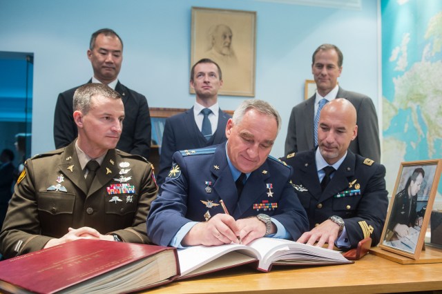 jsc2019e036800 (June 28, 2019) --- At the Gagarin Cosmonaut Training Center in Star City, Russia, Expedition 60 crewmember Alexander Skvortsov of Roscosmos (front row, middle) signs a ceremonial book June 28 during pre-launch activities. Looking on are prime crewmates Drew Morgan of NASA (left) and Luca Parmitano of the European Space Agency (right). In the back row from left to right are the backup crewmembers, Soichi Noguchi of the Japan Aerospace Exploration Agency, Sergey Ryzhikov of Roscosmos and Tom Marshburn of NASA. Morgan, Parmitano and Skvortsov will launch July 20 on the Soyuz MS-13 spacecraft from the Baikonur Cosmodrome in Kazakhstan for a mission on the International Space Station. Credit: Andrey Shelepin/GCTC