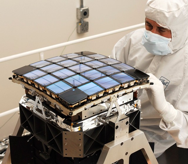A technician works with Kepler's focal plane