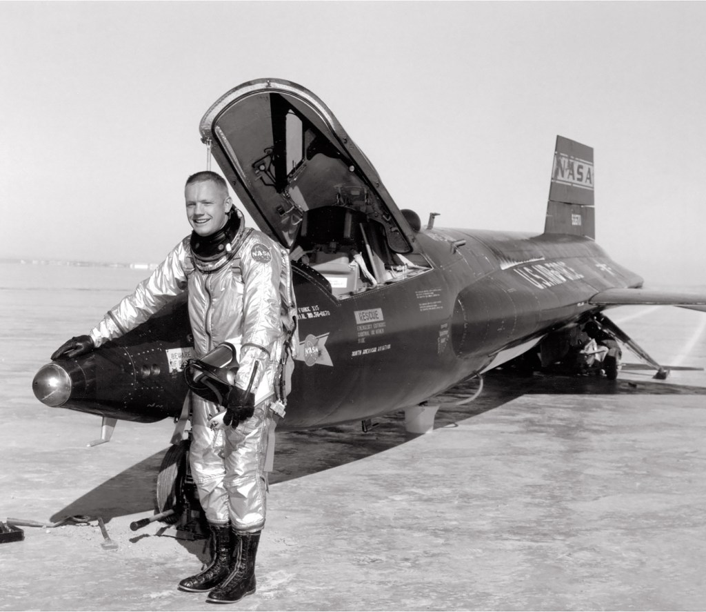 Man standing next to aircraft.