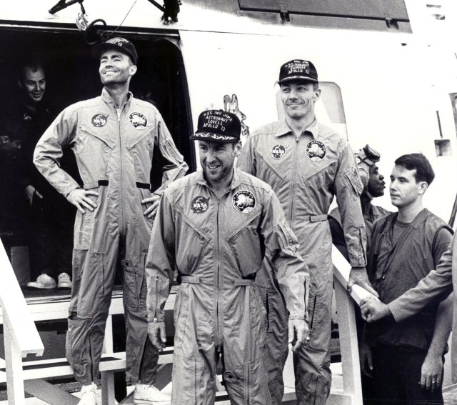 Three astronauts exited helicopter.