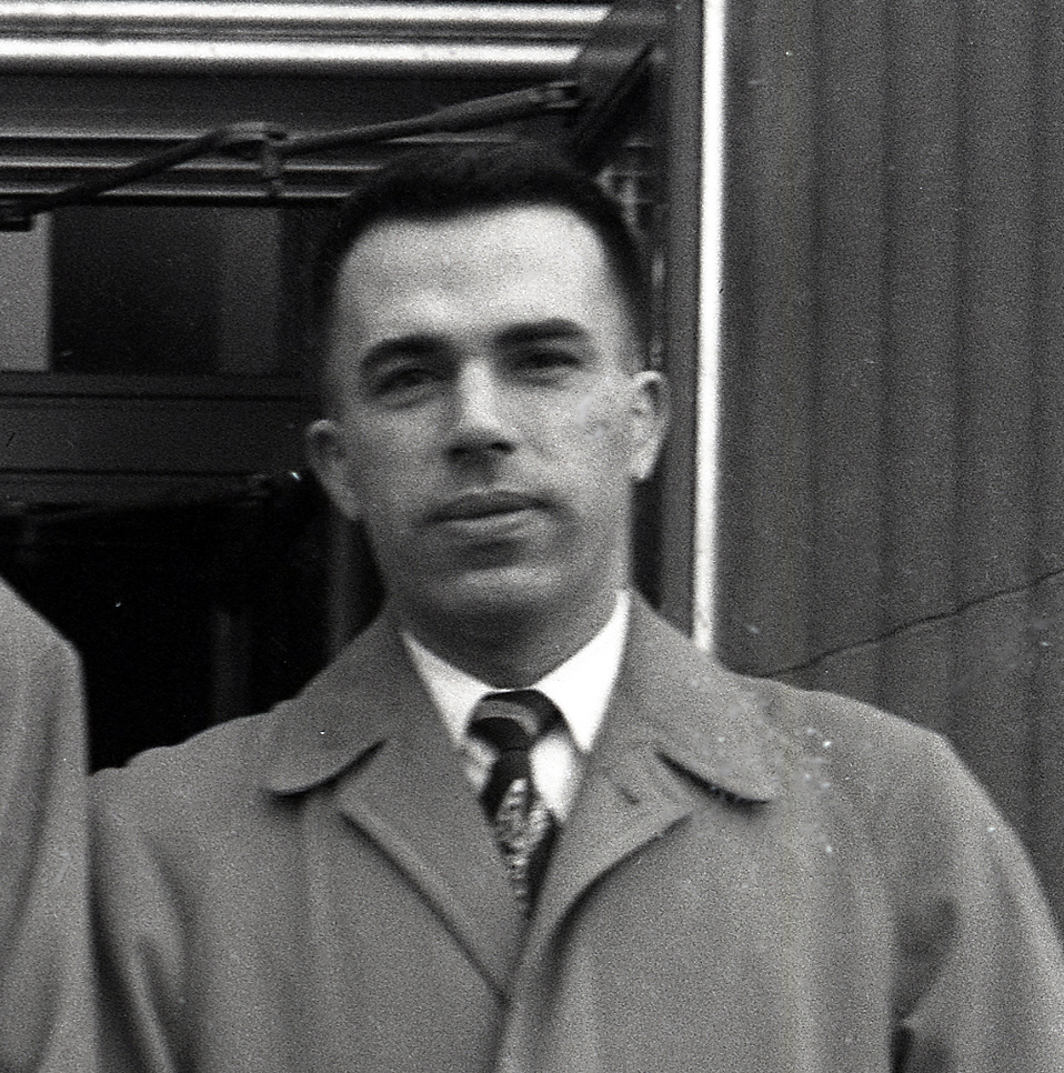 Man in overcoat.