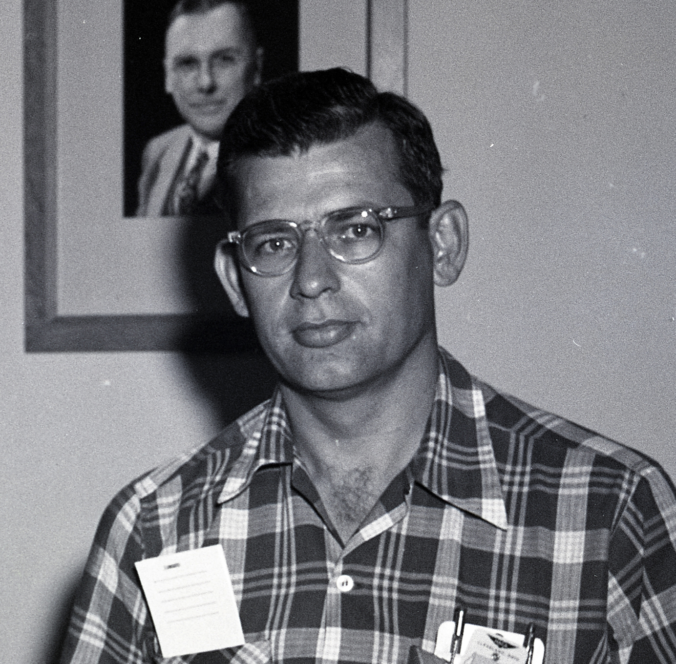Man in plaid shirt.