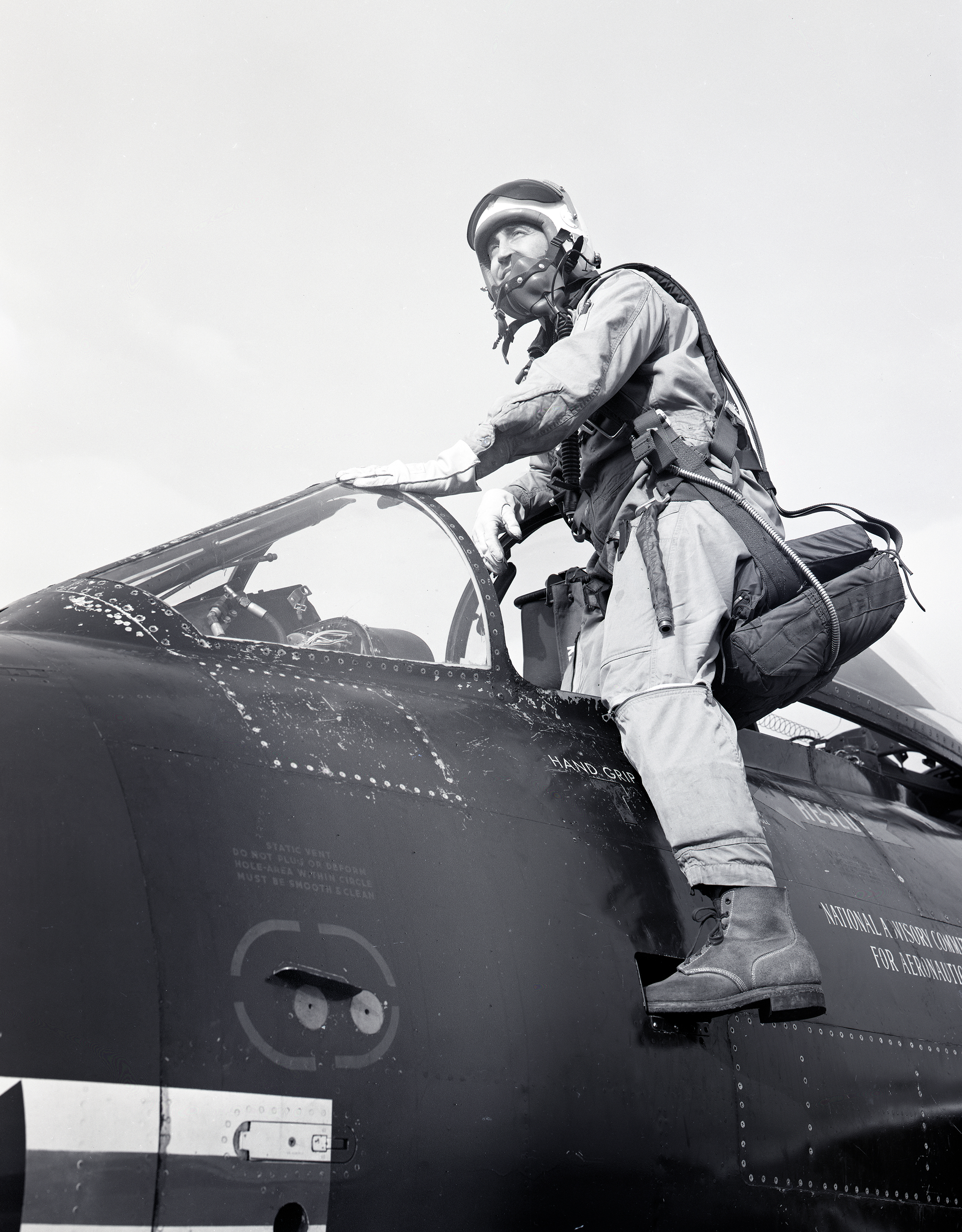 Pilot entering cockpit.