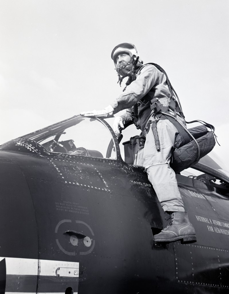 Pilot entering cockpit.