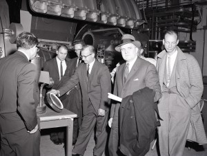 Group of men touring facility.