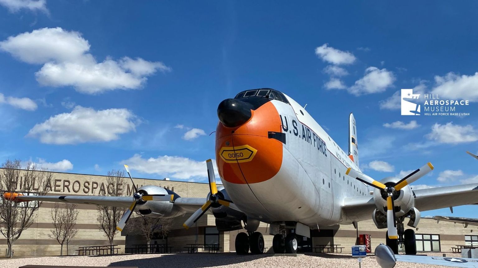 Hill Aerospace Museum with plane and logo