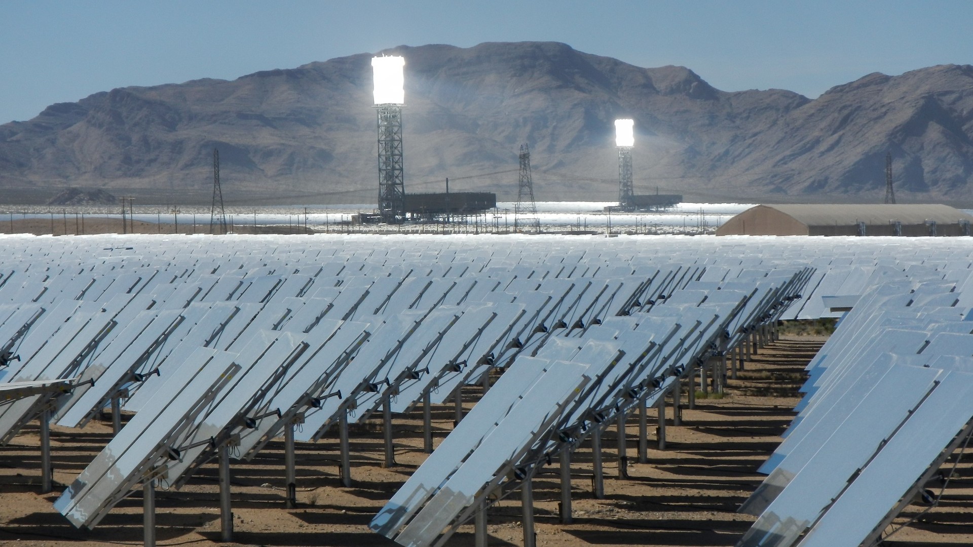 The Ivanpah Solar Electric Generating system, a field of mirrors with large towers in the background.