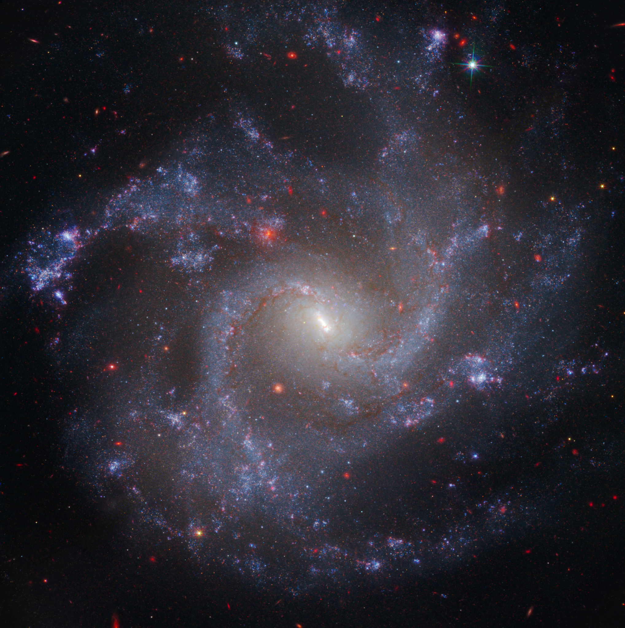 This image of NGC 5468, a galaxy located about 130 million light-years from Earth, combines data from the Hubble and James Webb space telescopes. This is the farthest galaxy in which Hubble has identified Cepheid variable stars. These are important milepost markers for measuring the expansion rate of the universe. The distance calculated from Cepheids has been cross-correlated with a type Ia supernova in the galaxy. Type Ia supernovae are so bright they are used to measure cosmic distances far beyond the range of the Cepheids, extending measurements of the universe's expansion rate deeper into space.