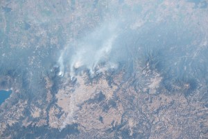 Wildfires fueled by hot, dry, and windy weather are pictured near the city of Quetzaltenango, Guatemala, by Expedition 70 Flight Engineer Jasmin Moghbeli of NASA as the International Space Station orbited 262 miles above the Central American nation.