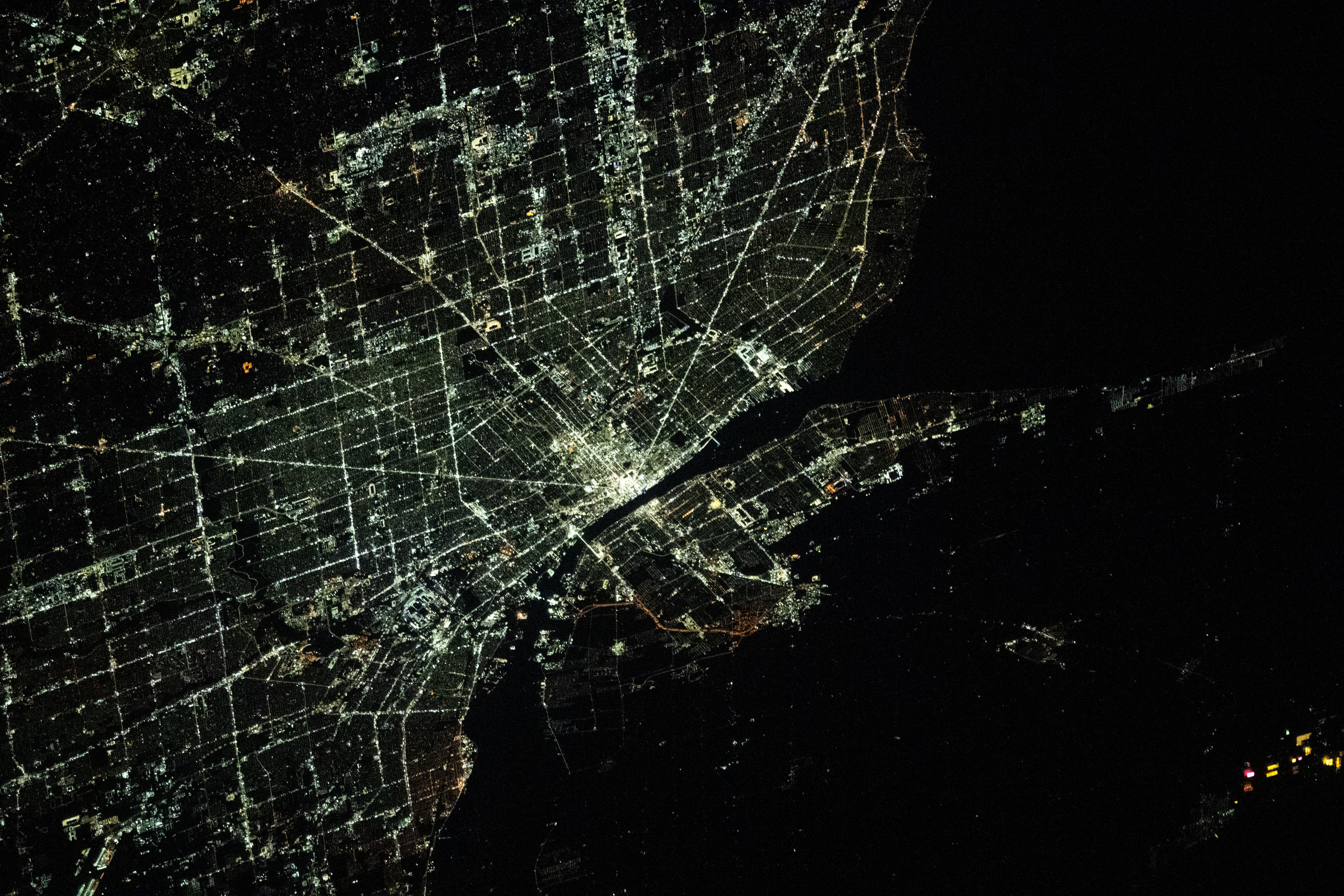 The city lights of Detroit, Michigan, separated from the city of Windsor in Ontario, Canada, by the Detroit River, are pictured from the International Space Station as it orbited 264 miles above.