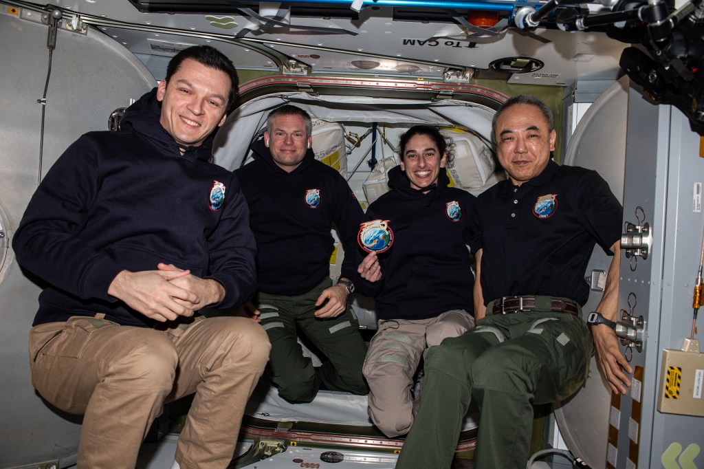 Four Expedition 70 crew members pose for a portrait inside the vestibule in between the SpaceX Dragon "Endurance" spacecraft and the International Space Station's Harmony module. The quartet also represent the SpaceX Crew-7 mission having lived and worked aboard the orbital outpost since Aug. 27, 2023. From left are, Roscosmos cosmonaut Konstantin Borisov, ESA (European Space Agency) astronaut Andreas Mogensen, NASA astronaut Jasmin Moghbeli, and JAXA (Japan Aerospace Exploration Agency) astronaut Satoshi Furukawa.