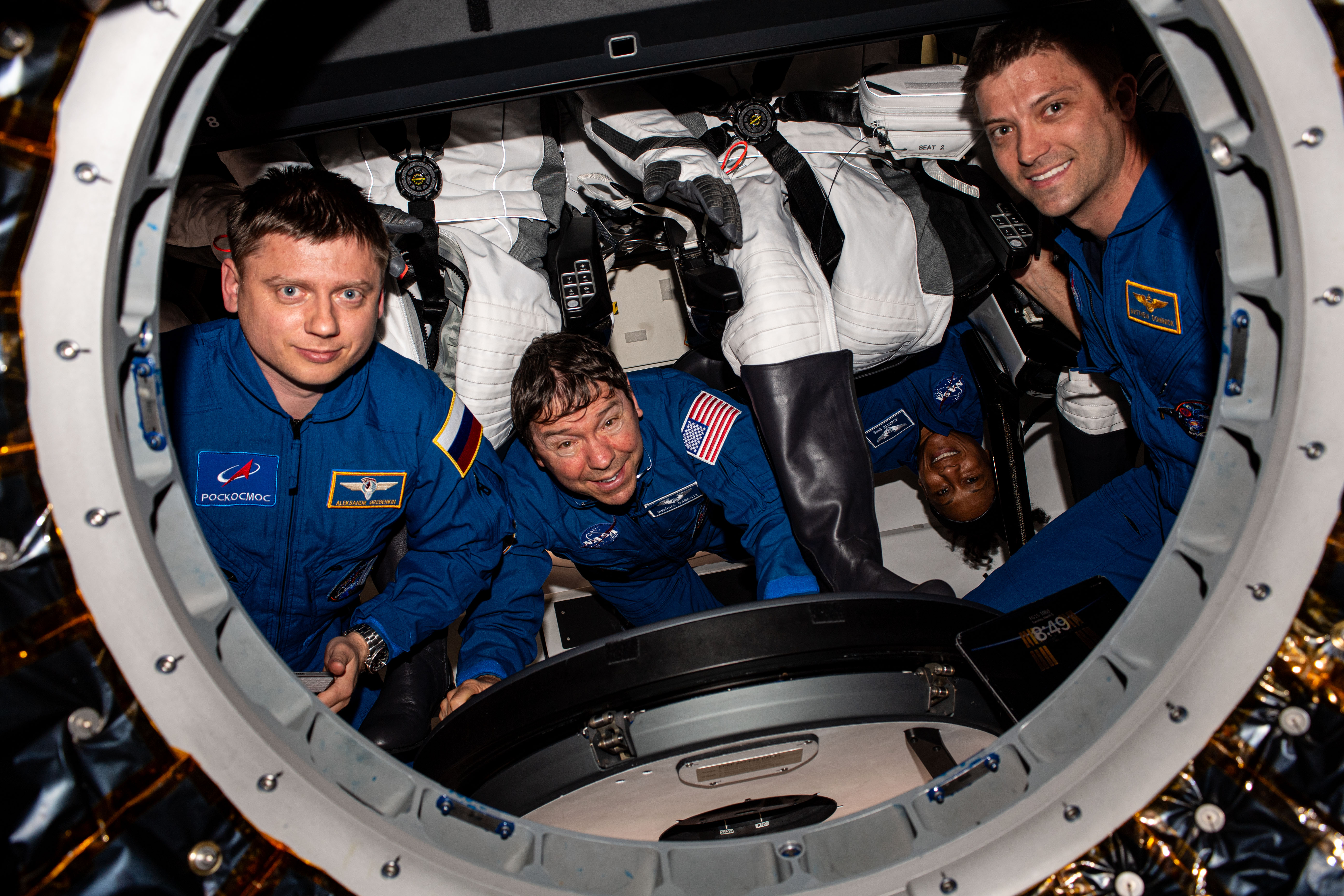 The four SpaceX Crew-8 members are pictured inside the SpaceX Dragon "Endeavour" spacecraft shortly after the hatch opened on the forward port of the International Space Station's Harmony module. From left are, Roscosmos cosmonaut Alexander Grebenkin and NASA astronauts Mike Barratt, Jeanette Epps, and Matthew Dominick.