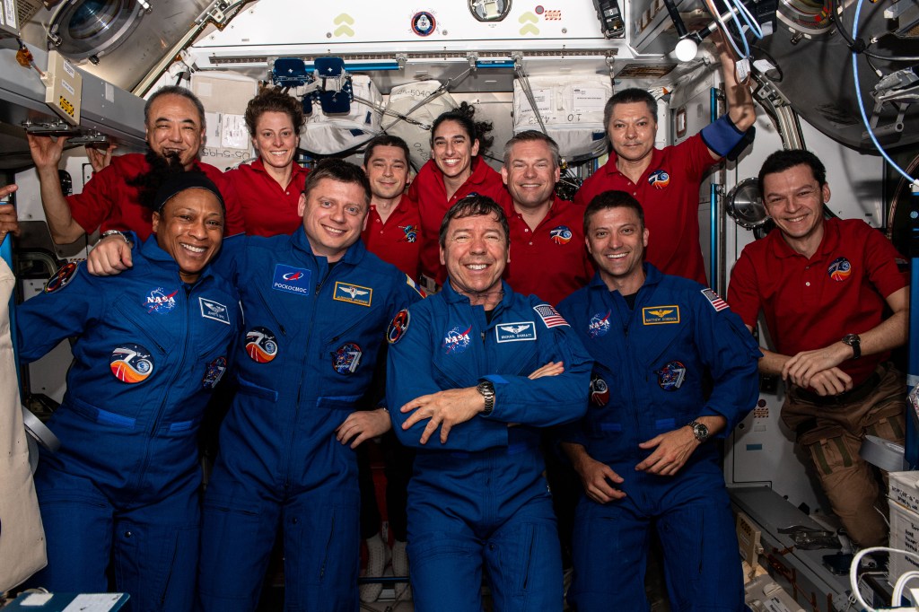 The four SpaceX Crew-8 members (front row) join the Expedition 70 crew (back row) for welcome remarks shortly after docking and entering the International Space Station on Tuesday, March 5, 2024. In the front row (from left), are SpaceX Crew-8 members Jeanette Epps from NASA, Alexander Grebenkin from Roscosmos, and NASA astronauts Mike Barratt and Matthew Dominick. In the back row (from left), are Expedition 70 crewmates Satoshi Furukawa from JAXA (Japan Aerospace Exploration Agency), Loral O’Hara from NASA, Nikolai Chub from Roscosmos, Jasmin Moghbeli from NASA, Andreas Mogensen from ESA (European Space Agency), and Roscosmos cosmonauts Oleg Kononenko and Konstantin Borisov.