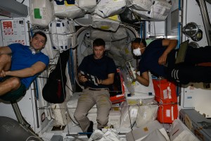 Expeditiom 70 Flight Engineers (from left) Nikolai Chub from Roscosmos, Matthew Dominick and Jeanette Epps, both from NASA, are pictured inside the International Space Station's Harmony module. The trio was awaiting the opening of the SpaceX Dragon cargo craft's hatch on Harmony's space-facing port.