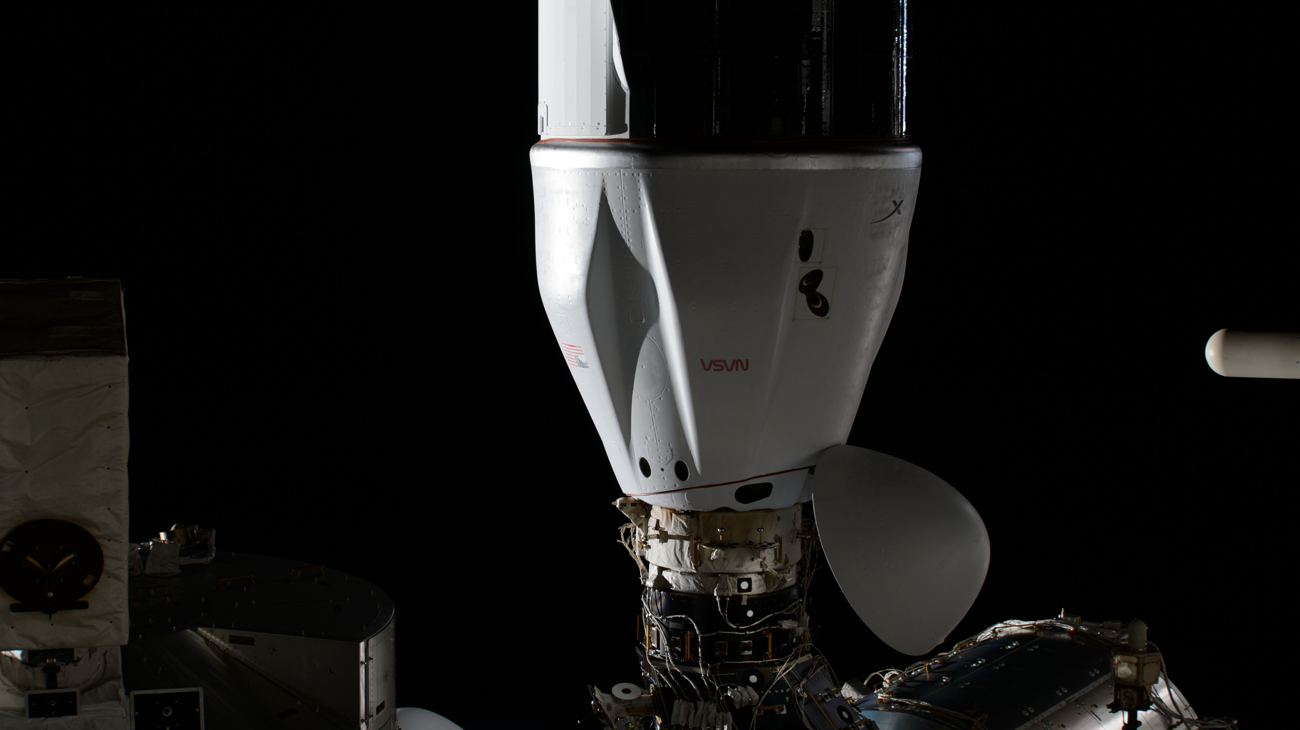 The SpaceX Dragon cargo spacecraft, on NASA's 30th Commercial Resupply Services (CRS-30) mission, is pictured docked to the space-facing port on the International Space Station's Harmony module.