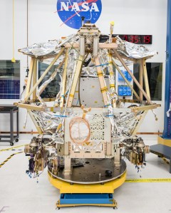 The VIPER Moon rover is pictured inside the clean room at NASA's Johnson Space Center. This photograph was taken during the installation of the forward radiator to VIPER's chassis. Credit: NASA/Helen Arase Vargas
