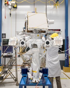 A team of engineers install the mast to VIPER's chassis inside the clean room at NASA's Johnson Space Center. Credit: NASA/Helen Arase Vargas 