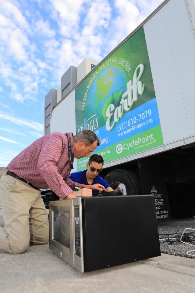 Members of the Sustainability team at NASA's Kennedy Space Center in Florida look over appliances donated for reuse or recycling in conjunction with America Recycles Day. America Recycles Day is a nationally recognized initiative dedicated to promoting recycling in the United States. Kennedy partnered with several organizations in order to donate as many of the items as possible to those who could use them the most in the Space Coast community. Space center personnel brought in electronic waste, gently used household goods, clothing and more.
