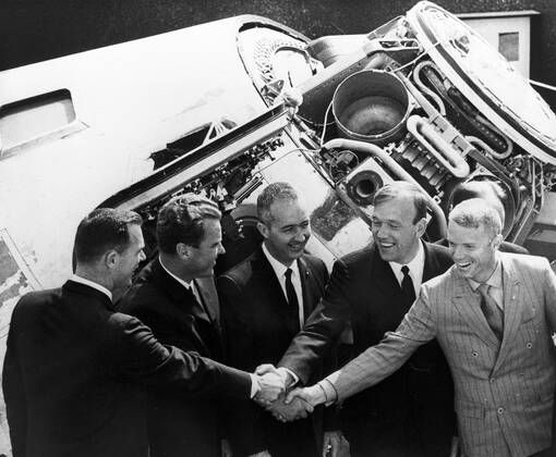 In front of the Apollo 8 Command Module at the 1969 Paris Air Show, astronauts meet cosmonauts – Scott, Vladimir A. Shatalov, McDivitt, Aleksei S. Yeliseyev, and Schweickart