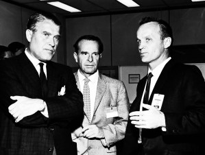 Three men talking.