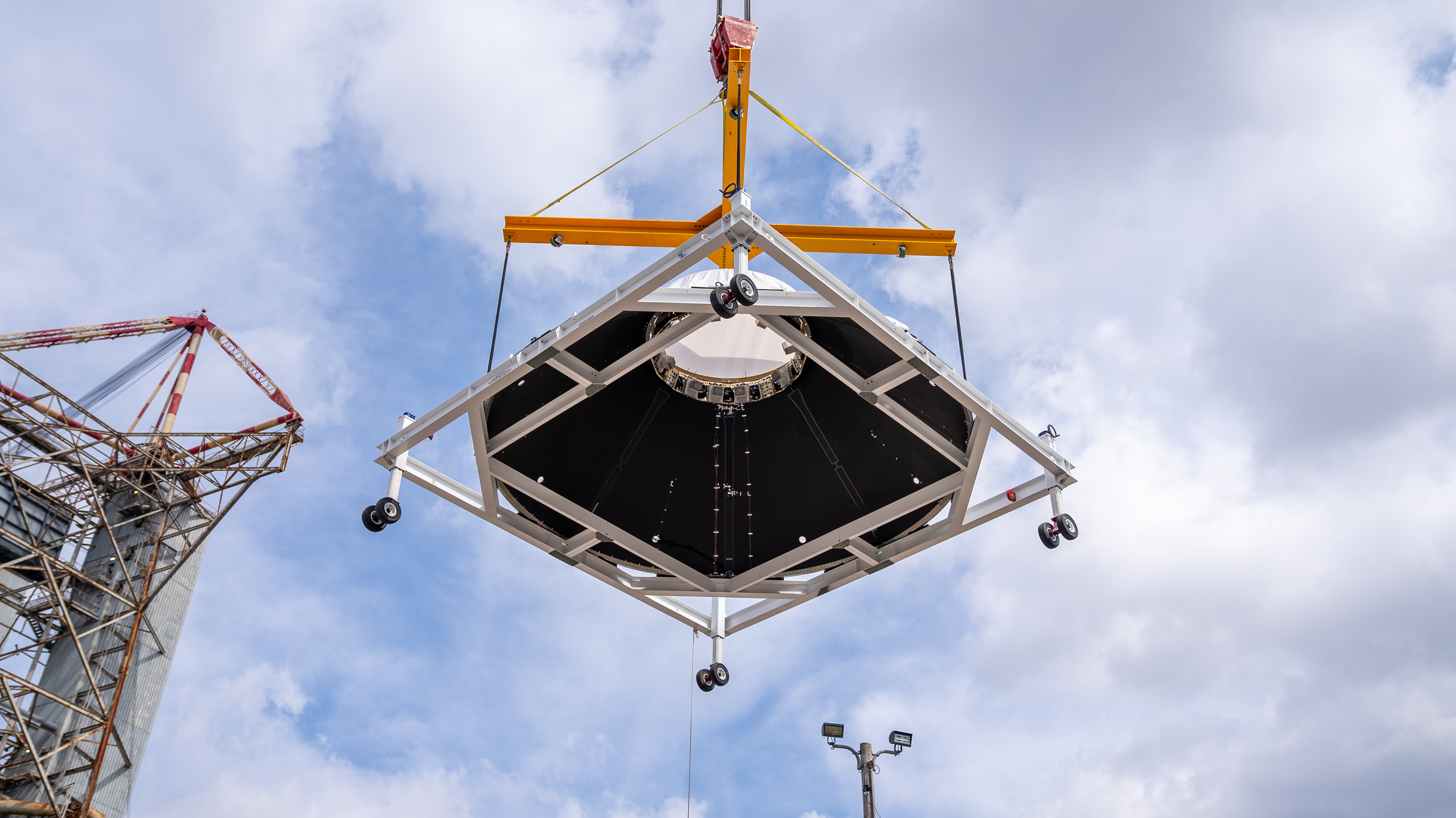 Teams at Marshall manufactured, prepared, and move the payload adapter test article. The payload adapter will undergo testing in the same test stand that once housed the SLS liquid oxygen tank structural test article.