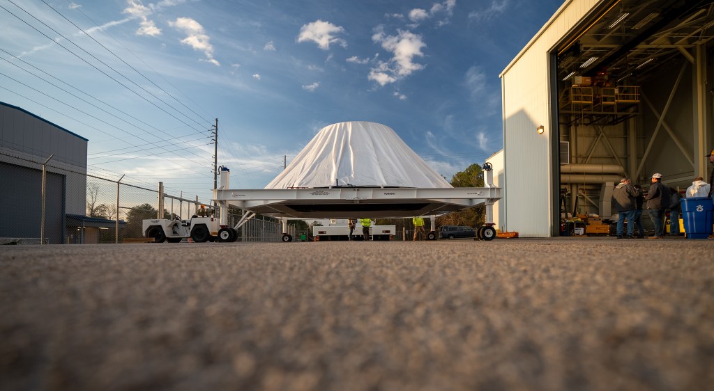 Teams at Marshall manufactured, prepared, and move the payload adapter test article. The payload adapter will undergo testing in the same test stand that once housed the SLS liquid oxygen tank structural test article.