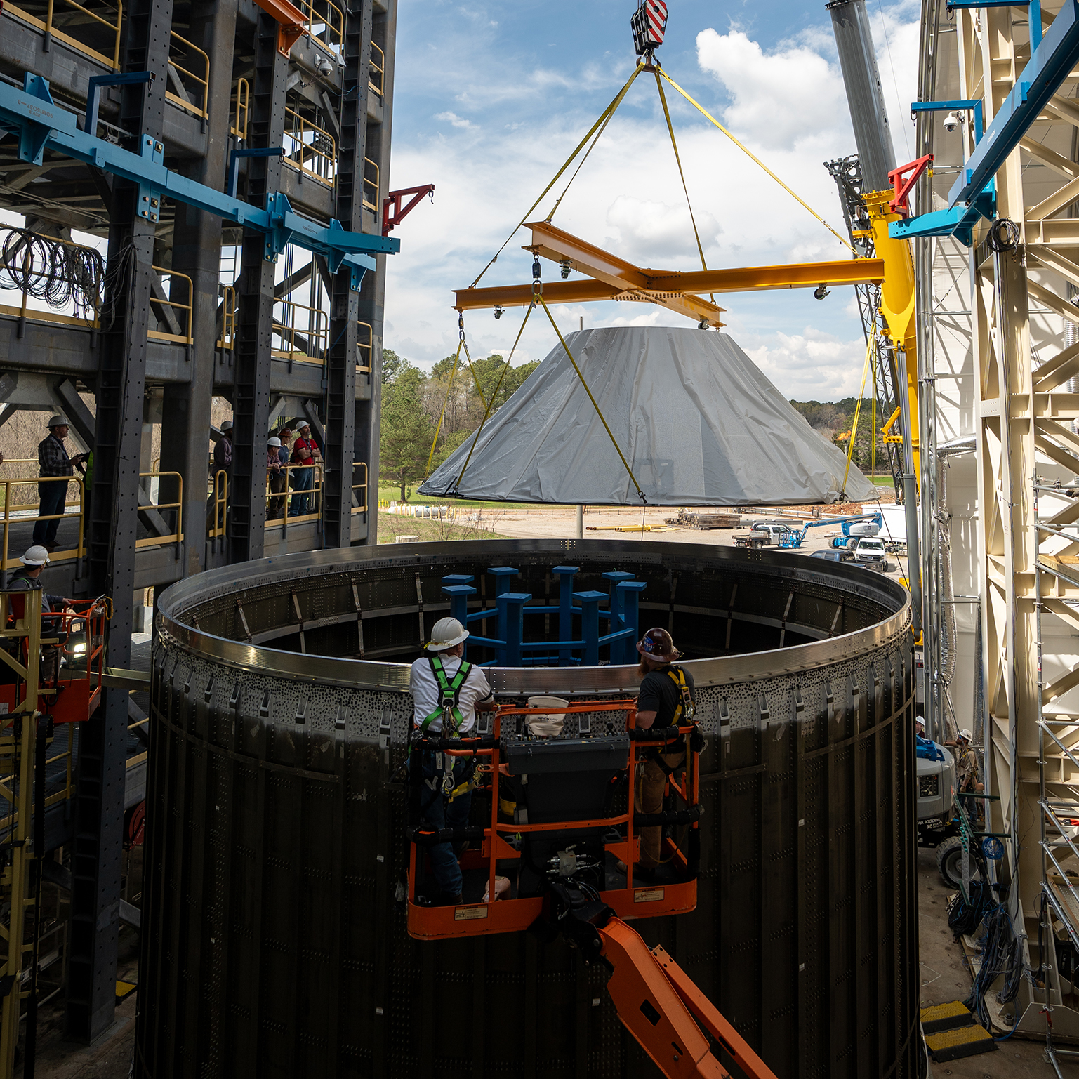 Teams at Marshall manufactured, prepared, and move the payload adapter test article. The payload adapter will undergo testing in the same test stand that once housed the SLS liquid oxygen tank structural test article.