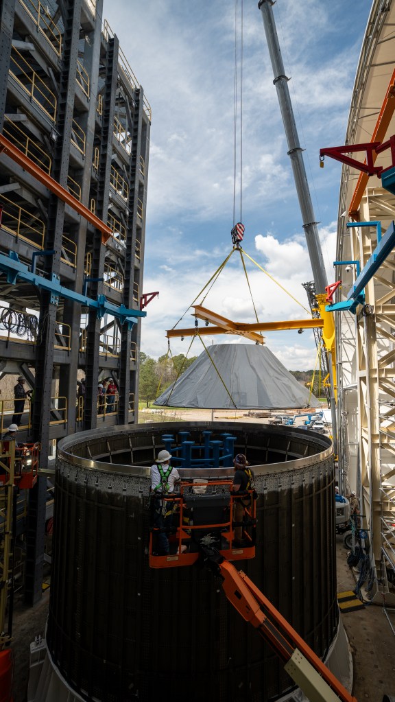 Teams at Marshall manufactured, prepared, and move the payload adapter test article. The payload adapter will undergo testing in the same test stand that once housed the SLS liquid oxygen tank structural test article.