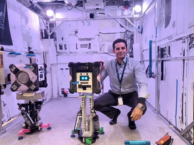 Marc Elmouttie, project lead for Commonwealth Scientific and Industrial Research Organization, with the Multi-resolution Scanner hardware and Astrobee robot ready for final pre-flight testing