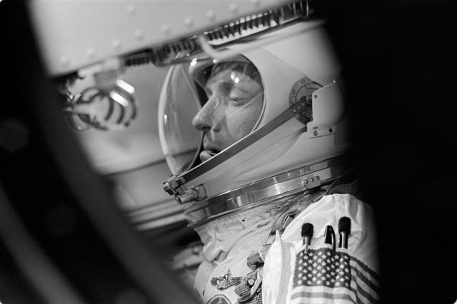 Astronaut Thomas P. Stafford, Gemini-6 prime crew pilot, is seen through spacecraft window as he awaits the remaining minutes of the Gemini-6 prelaunch countdown. A two-day mission in space was scheduled for astronauts Stafford and Walter M. Schirra Jr. (out of frame), command pilot. NASA successfully launched Gemini-6 from Pad 19 at 8:37 a.m. (EST) on Dec. 15, 1965. An attempt will be made to rendezvous Gemini-6 with Gemini-7. Photo credit: NASA or National Aeronautics and Space Administration
