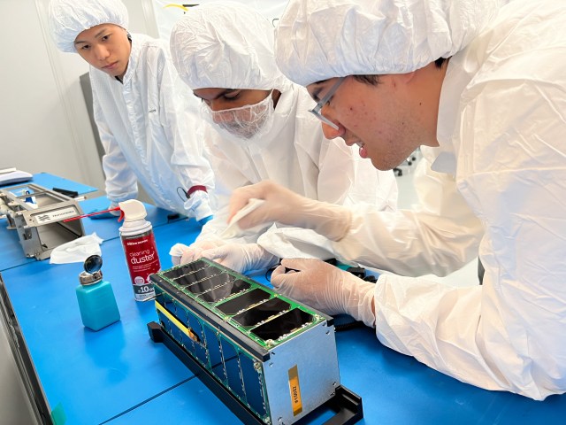 Image of University of Michigan students working on Measurement of Actuator Response and In Orbit (MARIO)