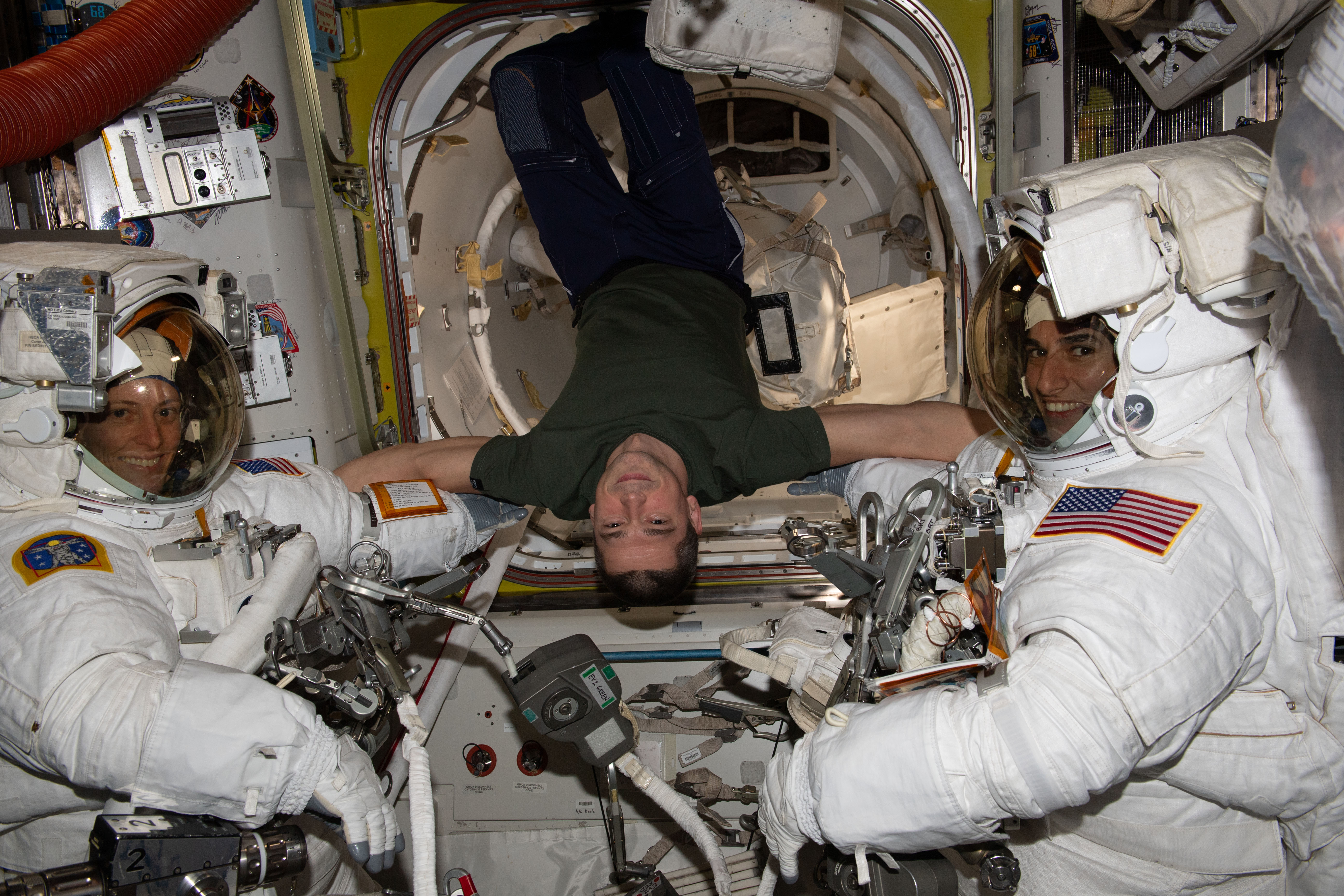 O’Hara, left, and Moghbeli, right, prepare for their spacewalk as Roscosmos cosmonaut Nikolai A. Chub assists.