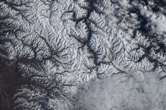 iss070e128500 (March 22, 2024) -- The snow-covered Eastern Himalayas were pictured from the International Space Station as it orbited 260 miles above China.