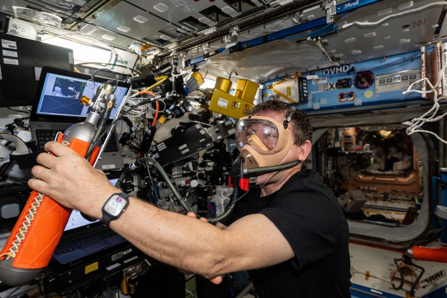Expedition 71 Flight Engineer and NASA astronaut Mike Barratt tests portable breathing gear aboard the International Space Station's Destiny laboratory module.