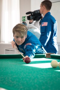 jsc2018e097769 - At her Cosmonaut Hotel crew quarters in Baikonur, Kazakhstan, Expedition 58 crew member Anne McClain of NASA tries her hand at a game of billiards Nov. 27 during free time from pre-launch training. McClain, David Saint-Jacques of the Canadian Space Agency and Oleg Kononenko of Roscosmos will launch Dec. 3 on the Soyuz MS-11 spacecraft from the Baikonur Cosmodrome in Kazakhstan for a six-and-a-half month mission on the International Space Station...NASA/Victor Zelentsov