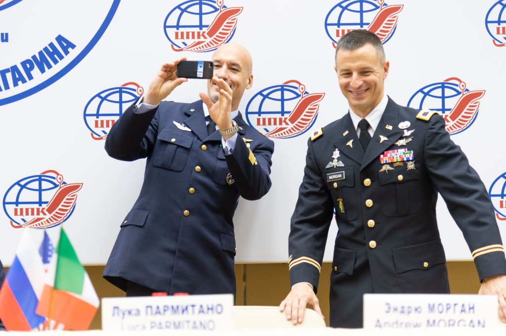 jsc2018e096930 (Nov. 15, 2018) --- At the Gagarin Cosmonaut Training Center in Star City, Russia, Expedition 58 backup crew members Luca Parmitano of the European Space Agency (left) and Drew Morgan of NASA (right) share a selfie Nov. 15 during the crew’s traditional news conference. They and Alexander Skvortsov of Roscosmos are the backups to Oleg Kononenko of Roscosmos, Anne McClain of NASA and David Saint-Jacques of the Canadian Space Agency, who will launch Dec. 3 on the Soyuz MS-11 spacecraft from the Baikonur Cosmodrome in Kazakhstan for a six-and-a-half month mission on the International Space Station...NASA/Sarah Volkman