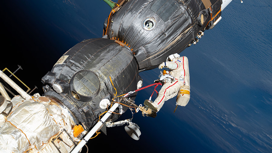 Cosmonaut Oleg Kononenko inspects the Soyuz MS-09 spacecraft during a spacewalk on Dec. 11, 2018.