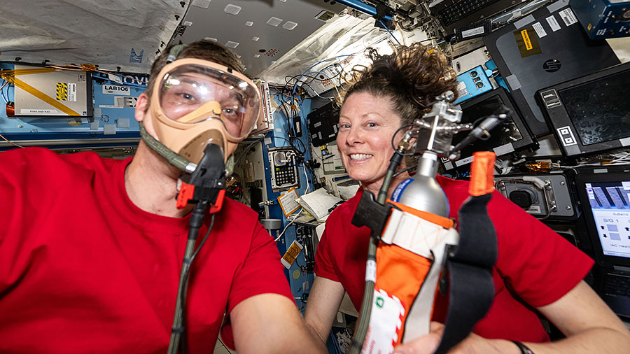 NASA astronauts Matthew Dominick and Tracy C. Dyson both pose for a fun portrait as Dominick tests portable breathing gear.