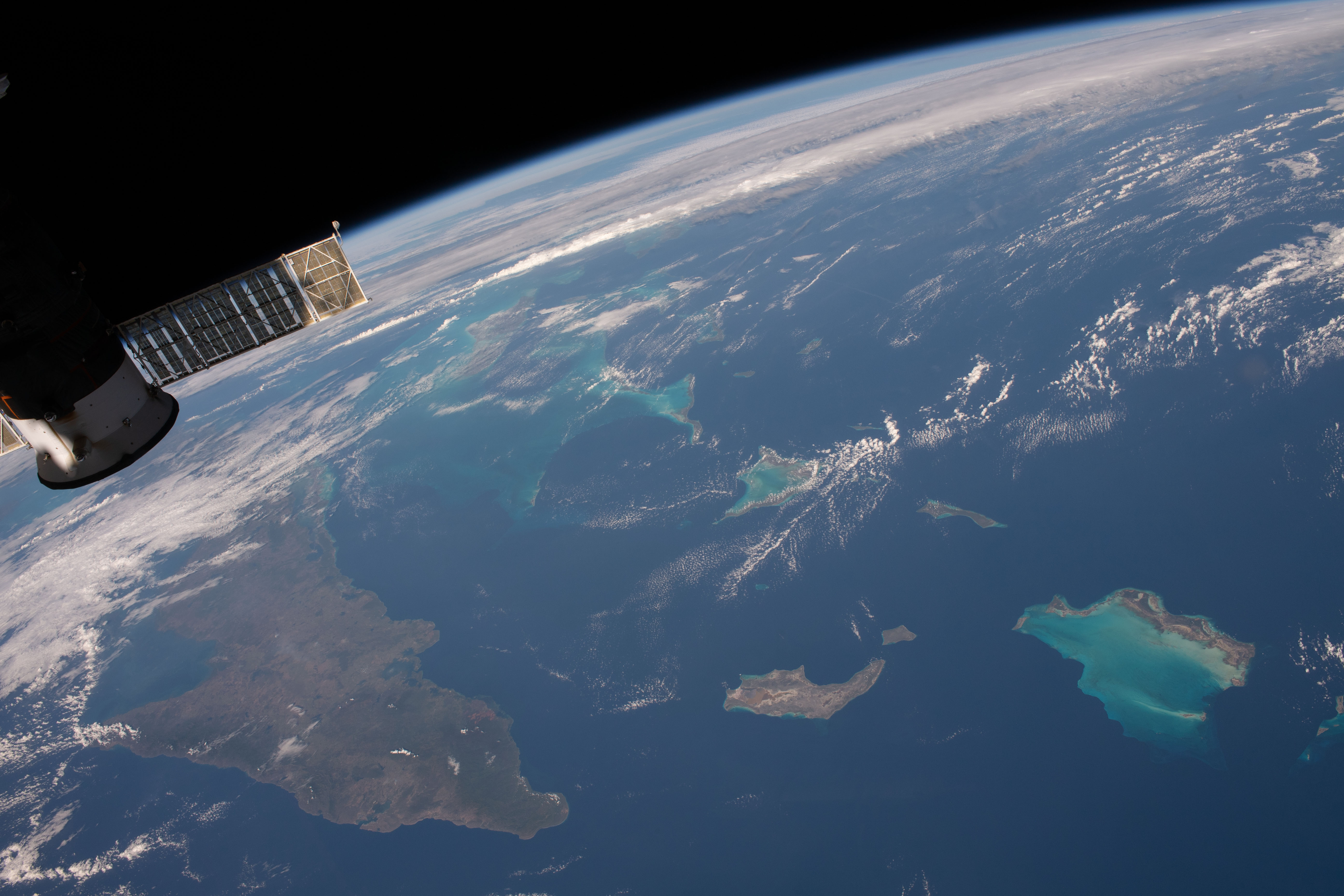 iss058e002206 (Jan. 5, 2018) --- Portions of Cuba, The Bahamas and the Turks and Caicos Islands are viewed from the International Space Station as the orbital complex flew 252 miles above the Atlantic Ocean. At left, is the aft end of the Progress 70 resupply ship from Russia attached to the Pirs docking compartment.