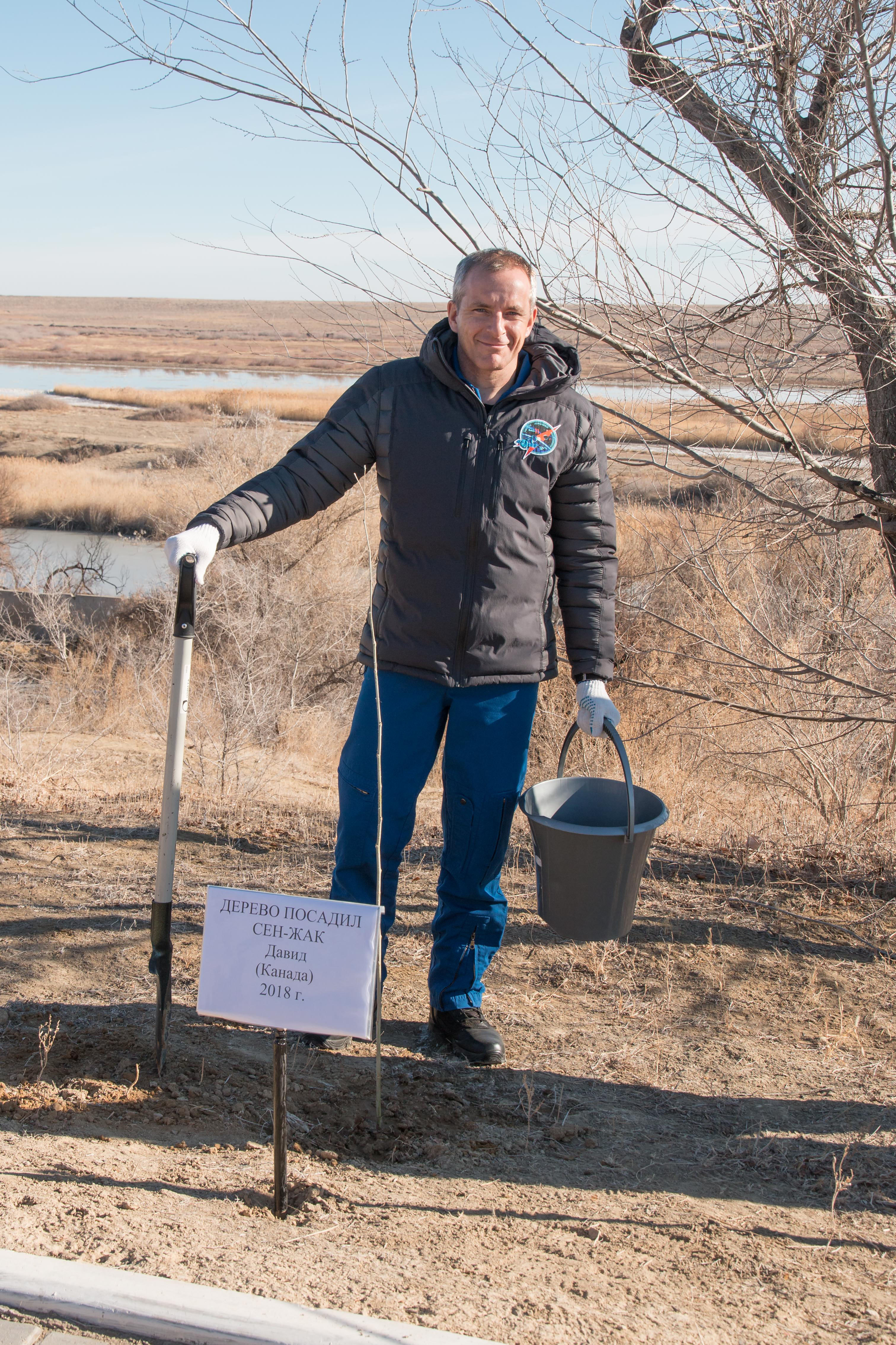 jsc2018e097777 - At the Cosmonaut Hotel crew quarters in Baikonur, Kazakhstan, Expedition 58 crew member David Saint-Jacques of the Canadian Space Agency poses for pictures Nov. 27 after planting a tree in his name in traditional pre-launch activities. Saint-Jacques, Anne McClain of NASA and Oleg Kononenko of Roscosmos will launch Dec. 3 on the Soyuz MS-11 spacecraft from the Baikonur Cosmodrome in Kazakhstan for a six-and-a-half month mission on the International Space Station...NASA/Victor Zelentsov