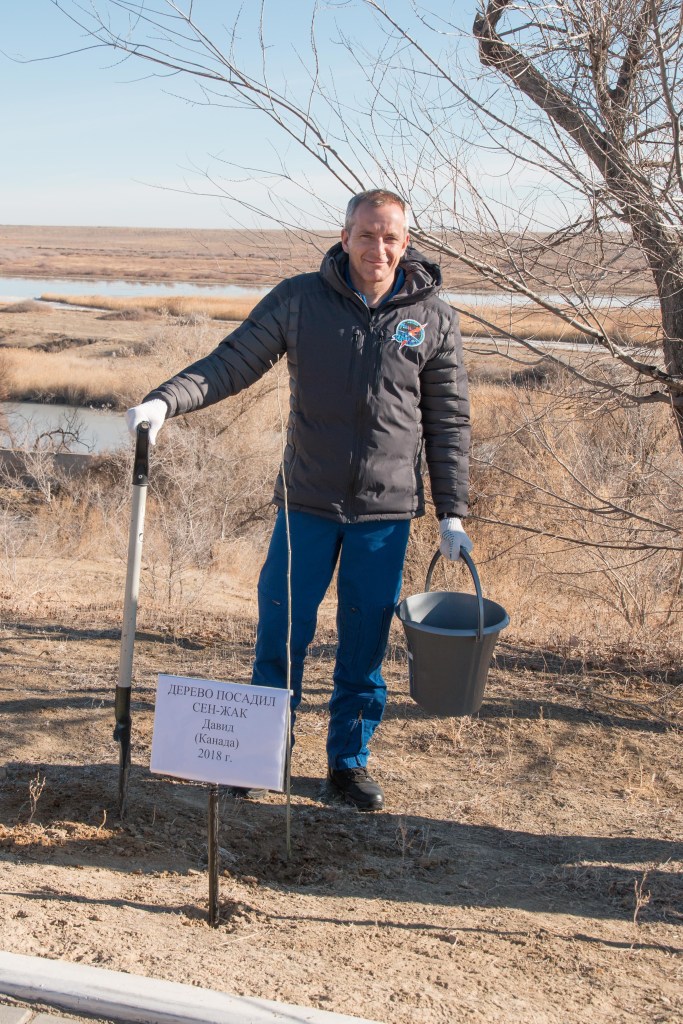 jsc2018e097777 - At the Cosmonaut Hotel crew quarters in Baikonur, Kazakhstan, Expedition 58 crew member David Saint-Jacques of the Canadian Space Agency poses for pictures Nov. 27 after planting a tree in his name in traditional pre-launch activities. Saint-Jacques, Anne McClain of NASA and Oleg Kononenko of Roscosmos will launch Dec. 3 on the Soyuz MS-11 spacecraft from the Baikonur Cosmodrome in Kazakhstan for a six-and-a-half month mission on the International Space Station...NASA/Victor Zelentsov