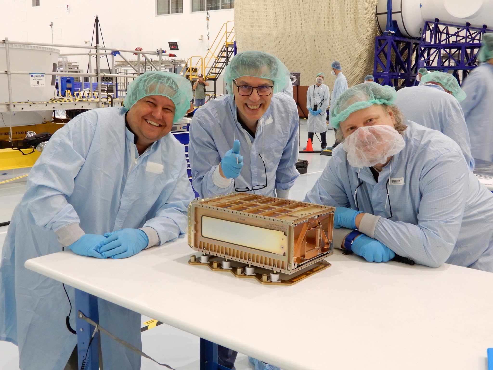 Members of Team Miles with the CubeSat developed during the NASA Cube Quest Challenge. From left to right: Alex Wingeier, Don Smith, Wes Faler. Image Credit: Team Miles