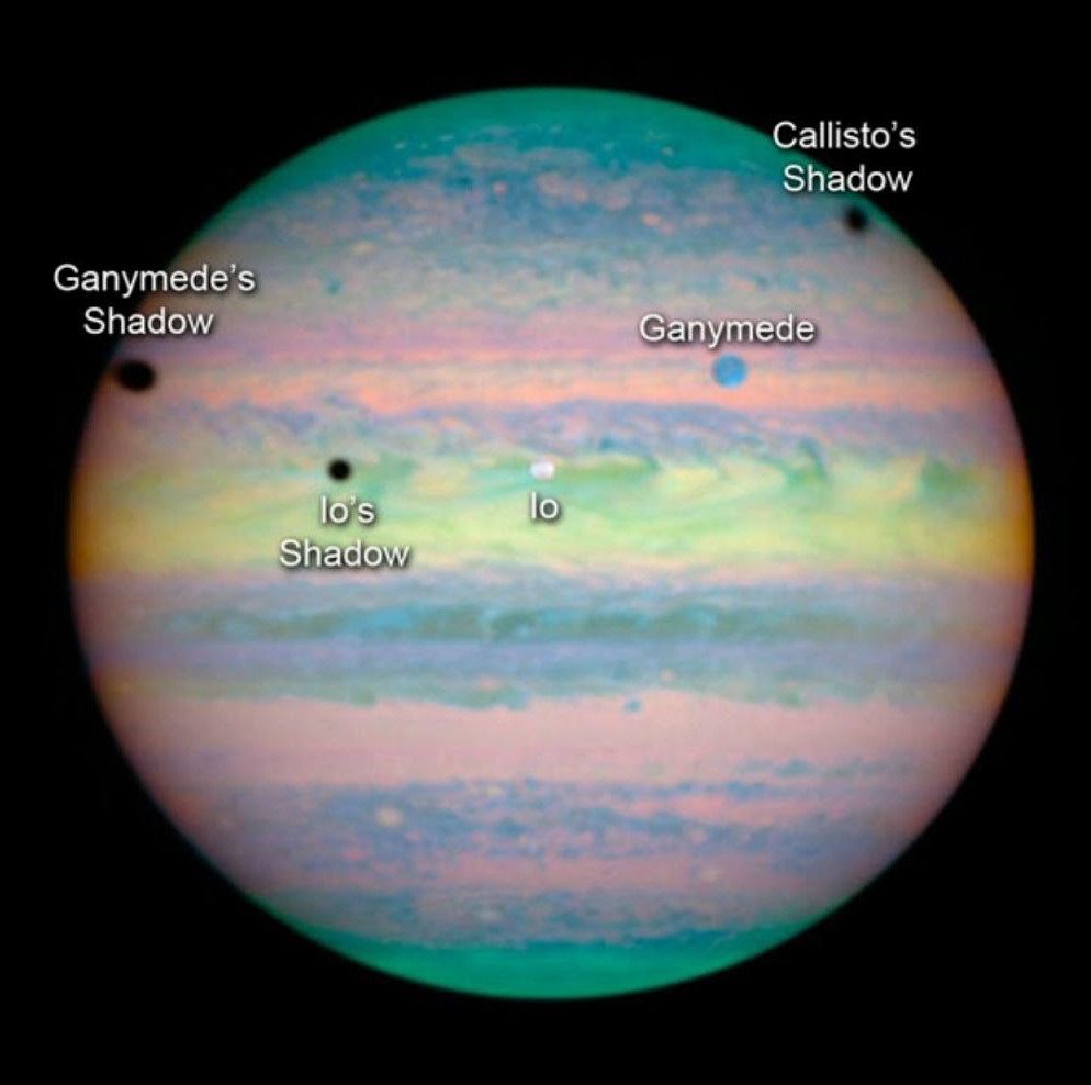 Hubble Space Telescope image of the Jan. 24, 2015, multiple eclipse on Jupiter, with five of its moons – Callisto, Io, Europa, Amalthea, and Thebe – casting shadows on the planet