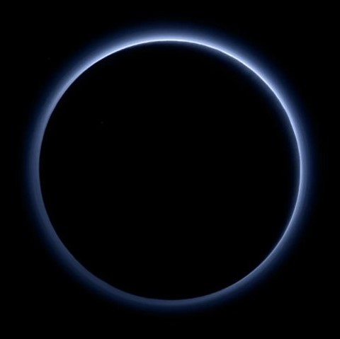 The New Horizons spacecraft created an artificial eclipse as it flew behind Pluto during its July 2015 flyby, the Sun’s rays highlighting its tenuous atmosphere